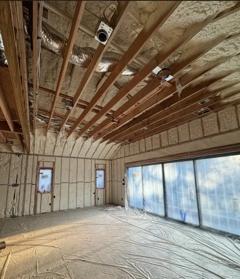 Interior walls and ceiling insulated with spray foam during new construction in San Diego